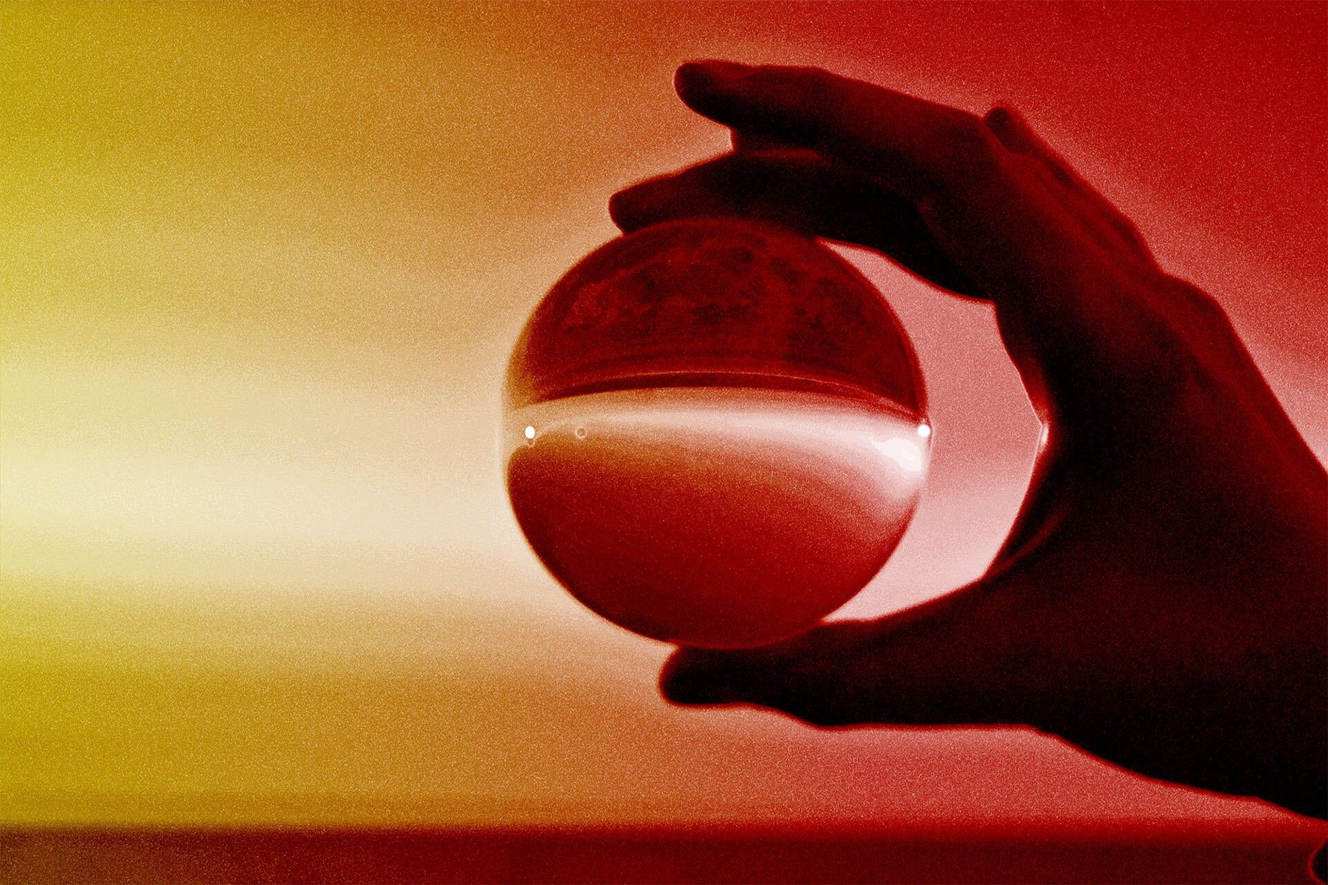 Hand holding a glowing red orb against a warm gradient background, suggesting mysterious, ethereal, and atmospheric samples.
