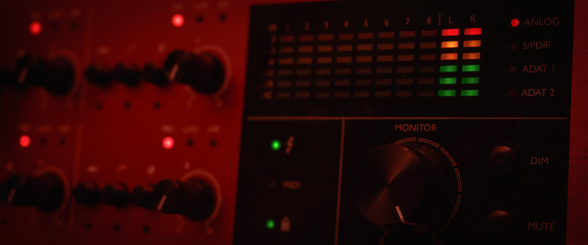 Close-up of an audio interface with illuminated meters and dials, capturing the gritty, analog vibe of recording equipment. Perfect for showcasing vintage sound design and sample packs with a raw, lo-fi aesthetic.
